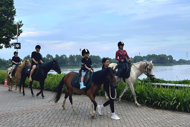 Hanoi Horseback Riding Club & Tours - Exclusive Experience - Entering Gamuda Yen So Park: a rare break from Hanoi noise