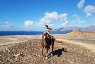 Horseback Riding in the sunset of Famara Beach, Lanzarote, Spain - Meet Tomea and Olga, and Why the Horses Matter