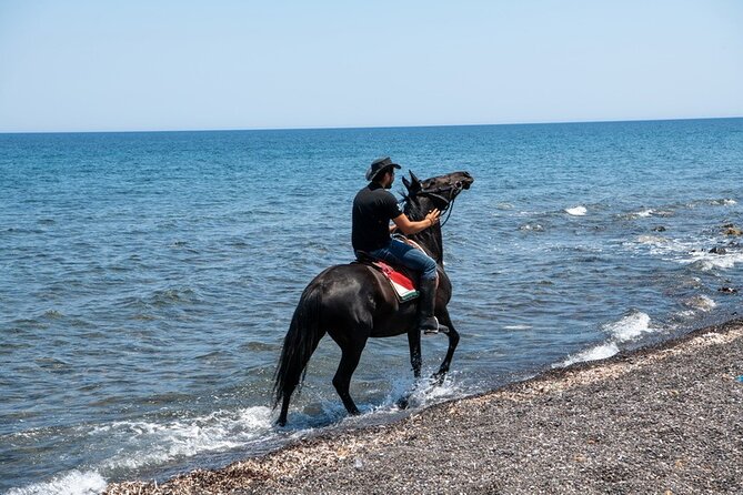 Premium Secluded Black Beach Horseback Riding Tour in Santorini - The Thira fishermen’s port stop and the tiny church photo moment